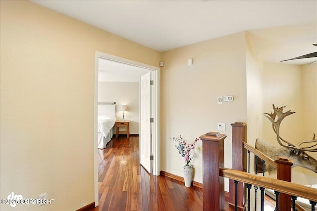 10410 Constitution St, Anchorage, AK 99515 - hallway featuring an upstairs landing, wood-type flooring, and baseboards