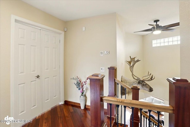10410 Constitution St, Anchorage, AK 99515 - hallway featuring hardwood / wood-style flooring, baseboards, and an upstairs landing