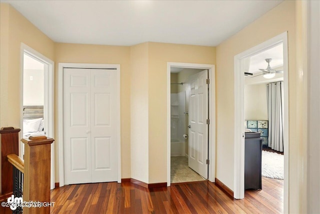 10410 Constitution St, Anchorage, AK 99515 - bedroom with dark wood finished floors, baseboards, a closet, and ensuite bathroom