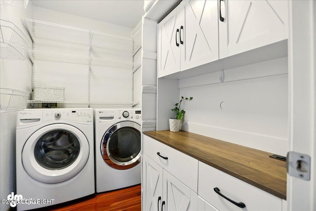10410 Constitution St, Anchorage, AK 99515 - washroom with separate washer and dryer, cabinet space, and dark wood finished floors