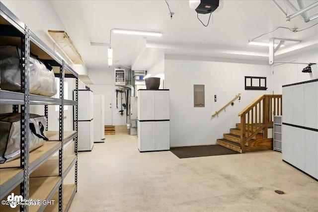 10410 Constitution St, Anchorage, AK 99515 - basement featuring electric panel, freestanding refrigerator, and stairs
