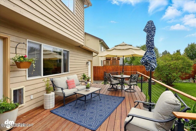 10410 Constitution St, Anchorage, AK 99515 - wooden terrace featuring outdoor dining space and an outdoor hangout area