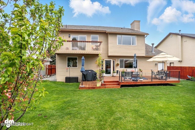 10410 Constitution St, Anchorage, AK 99515 - back of property with a chimney, a balcony, a deck, and outdoor dining area