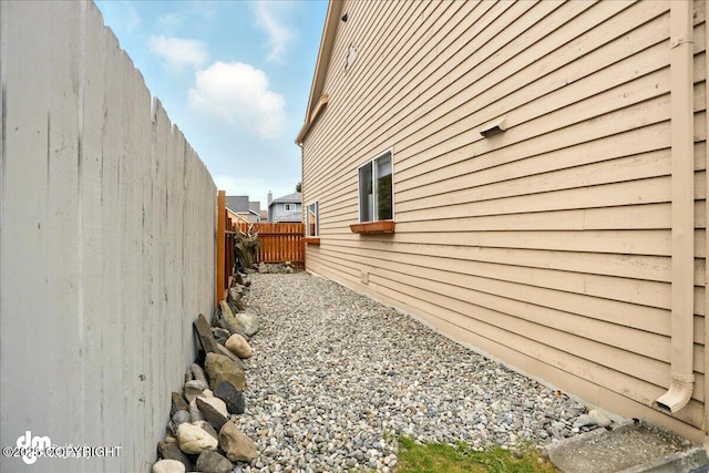 10410 Constitution St, Anchorage, AK 99515 - view of home's exterior with a fenced backyard