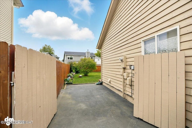 10410 Constitution St, Anchorage, AK 99515 - view of side of property featuring a patio area