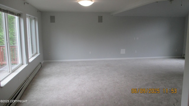 20638 Driftwood Bay Dr, Eagle River, AK 99577 - spare room featuring a baseboard heating unit, light colored carpet, and baseboards