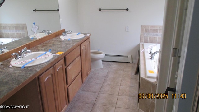 20638 Driftwood Bay Dr, Eagle River, AK 99577 - full bathroom featuring baseboard heating, a garden tub, tile patterned floors, double vanity, and toilet