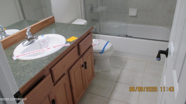 20638 Driftwood Bay Dr, Eagle River, AK 99577 - bathroom with vanity, toilet, tile patterned floors, and shower / bath combination with glass door