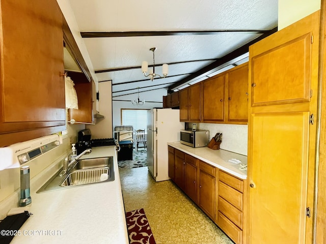 1310 Madsen Ave, Kodiak, AK 99615 - kitchen featuring stainless steel microwave, a sink, light countertops, and freestanding refrigerator