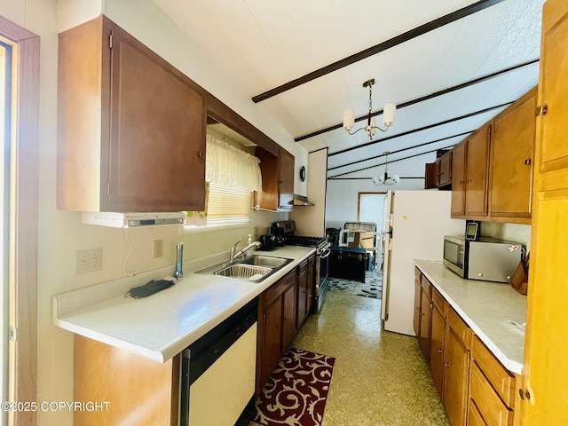 1310 Madsen Ave, Kodiak, AK 99615 - kitchen with stainless steel appliances, a sink, light countertops, brown cabinets, and under cabinet range hood
