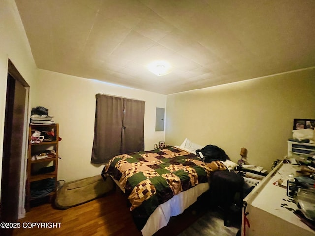 1310 Madsen Ave, Kodiak, AK 99615 - bedroom featuring electric panel and wood finished floors