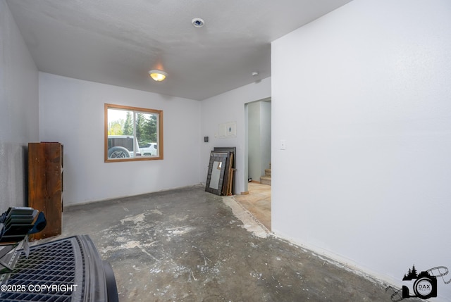 639 E Beaver Ave, Palmer, AK 99645 - unfurnished living room with unfinished concrete flooring