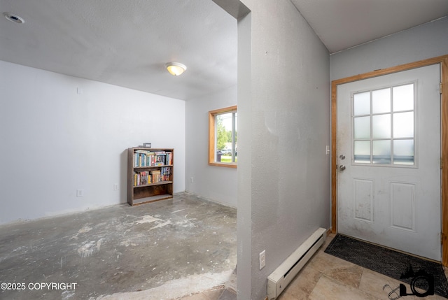 639 E Beaver Ave, Palmer, AK 99645 - entryway featuring a baseboard heating unit and unfinished concrete flooring
