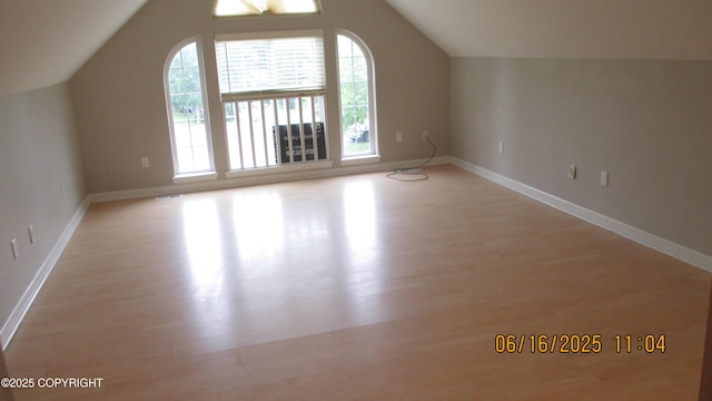 2024 Oxbow Cir, Anchorage, AK 99516 - bonus room featuring plenty of natural light, light wood-type flooring, and vaulted ceiling