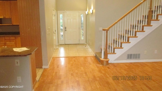 2024 Oxbow Cir, Anchorage, AK 99516 - foyer entrance featuring light wood-style floors and stairway