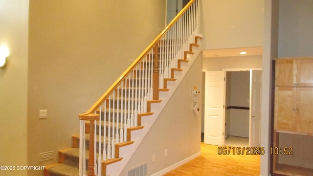 2024 Oxbow Cir, Anchorage, AK 99516 - staircase with a high ceiling and wood finished floors