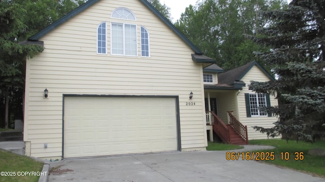 2024 Oxbow Cir, Anchorage, AK 99516 - traditional-style house with a garage and concrete driveway