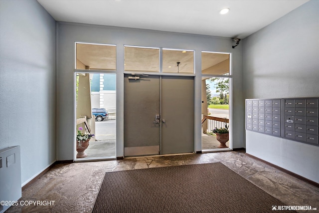 836 M St # 215, Anchorage, AK 99501 - foyer entrance featuring healthy amount of natural light, mail area, and baseboards
