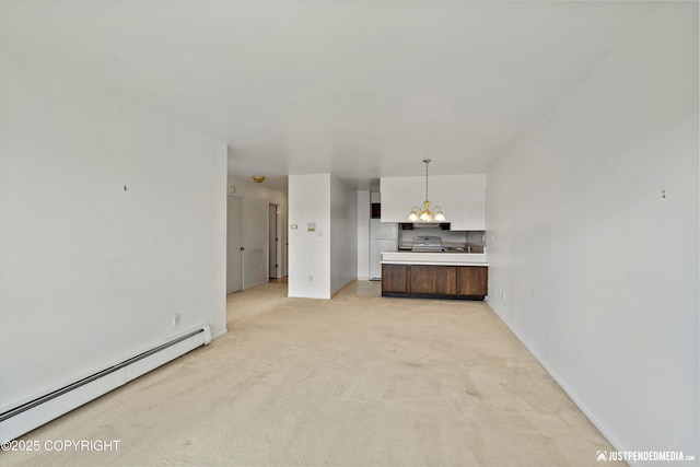 836 M St # 215, Anchorage, AK 99501 - unfurnished living room with baseboard heating, light colored carpet, baseboards, and a chandelier