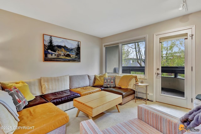 1200 I St # 206, Anchorage, AK 99501 - living area featuring a baseboard heating unit and light carpet