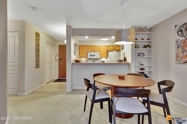 1200 I St # 206, Anchorage, AK 99501 - dining room with light carpet, baseboards, and recessed lighting