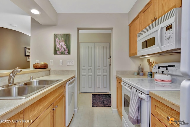 1200 I St # 206, Anchorage, AK 99501 - kitchen with white appliances, a sink, light countertops, and light tile patterned floors