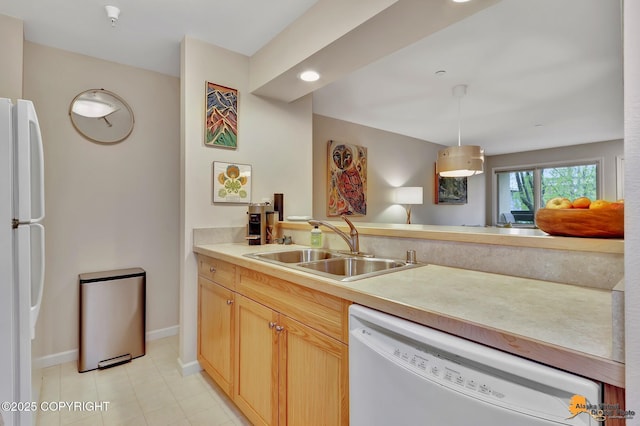 1200 I St # 206, Anchorage, AK 99501 - kitchen with white appliances, a sink, baseboards, and light countertops