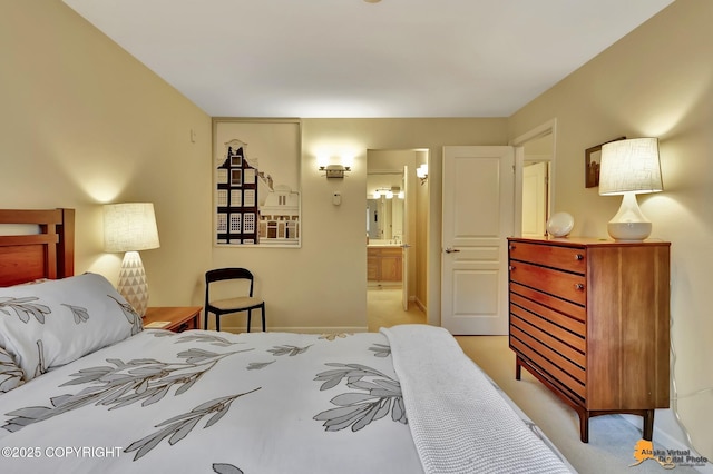 1200 I St # 206, Anchorage, AK 99501 - bedroom featuring connected bathroom, light colored carpet, and baseboards
