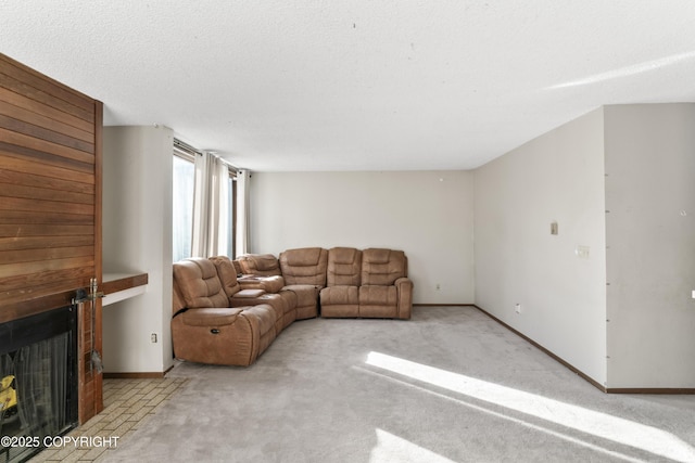 1003 Wildrose Ct # 1003, Anchorage, AK 99518 - carpeted living area with baseboards and a fireplace