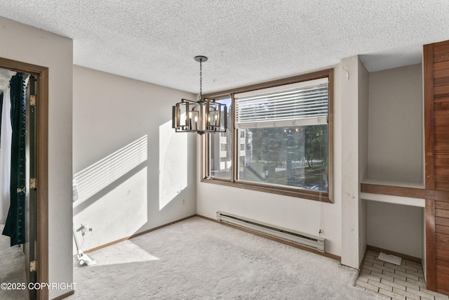 1003 Wildrose Ct # 1003, Anchorage, AK 99518 - unfurnished dining area featuring a baseboard heating unit, a chandelier, a textured ceiling, carpet flooring, and baseboards