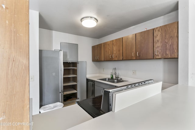 1003 Wildrose Ct # 1003, Anchorage, AK 99518 - kitchen with stainless steel appliances, light countertops, and a sink
