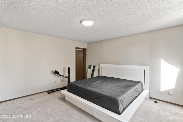 1003 Wildrose Ct # 1003, Anchorage, AK 99518 - carpeted bedroom with a textured ceiling, baseboards, and a closet