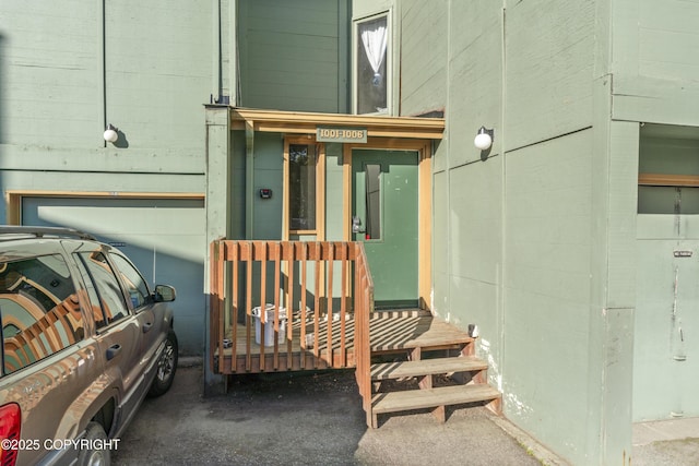 1003 Wildrose Ct # 1003, Anchorage, AK 99518 - entrance to property featuring concrete block siding and a garage