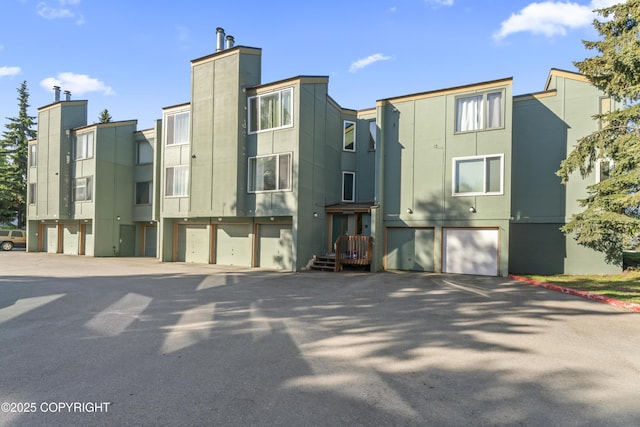 1003 Wildrose Ct # 1003, Anchorage, AK 99518 - view of property with an attached garage and driveway