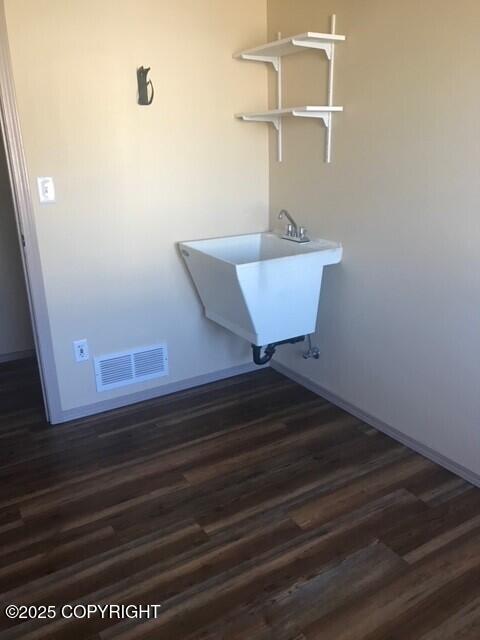 6334 Rose Hip Cir, Anchorage, AK 99507 - washroom with dark wood finished floors and baseboards