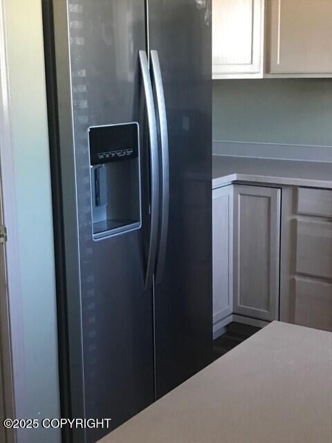 6334 Rose Hip Cir, Anchorage, AK 99507 - kitchen featuring stainless steel fridge and light countertops