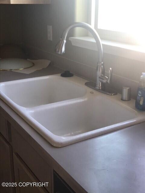 6334 Rose Hip Cir, Anchorage, AK 99507 - kitchen view of light countertops and tasteful backsplash
