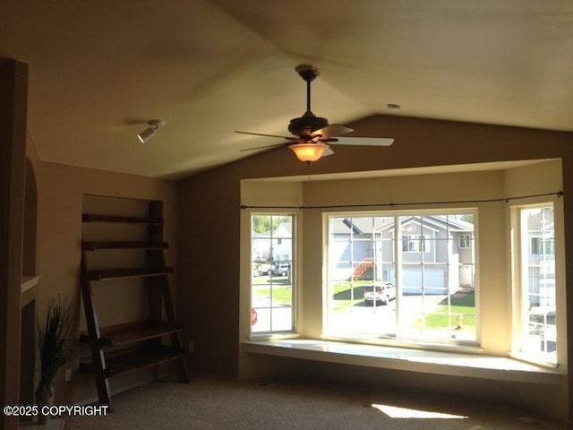 6334 Rose Hip Cir, Anchorage, AK 99507 - unfurnished living room with vaulted ceiling, a ceiling fan, and carpet
