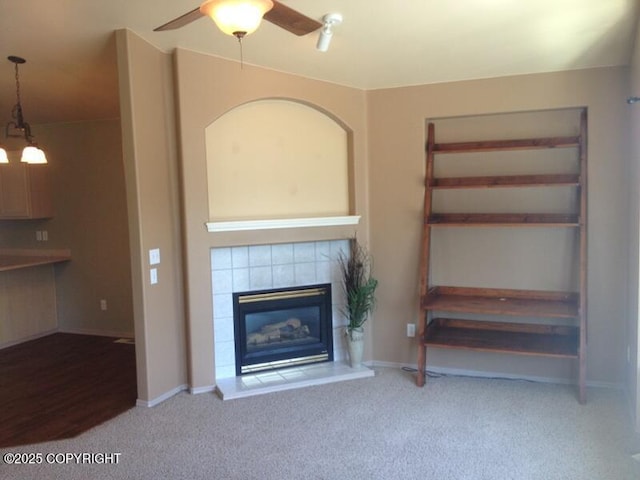 6334 Rose Hip Cir, Anchorage, AK 99507 - unfurnished living room featuring ceiling fan, carpet floors, and a fireplace