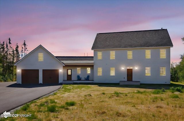 7350 E Narnia Cir, Palmer, AK 99645 - colonial house featuring asphalt driveway, a garage, and a yard