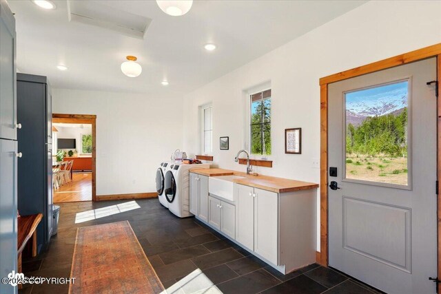7350 E Narnia Cir, Palmer, AK 99645 - washroom with cabinet space, separate washer and dryer, recessed lighting, and baseboards