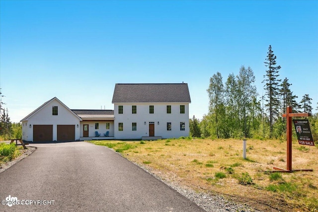7350 E Narnia Cir, Palmer, AK 99645 - colonial house with asphalt driveway and an attached garage