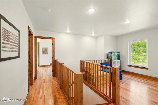 7350 E Narnia Cir, Palmer, AK 99645 - hallway featuring an upstairs landing, light wood finished floors, recessed lighting, and baseboards