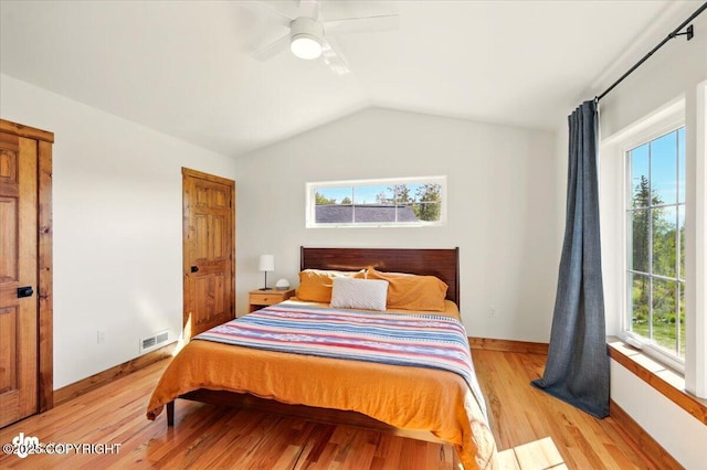 7350 E Narnia Cir, Palmer, AK 99645 - bedroom featuring lofted ceiling, light wood-type flooring, baseboards, and a ceiling fan