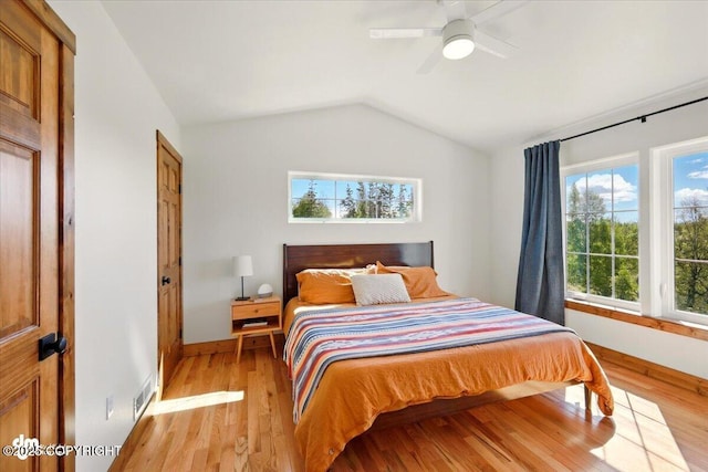 7350 E Narnia Cir, Palmer, AK 99645 - bedroom featuring baseboards, light wood-style floors, lofted ceiling, and a ceiling fan