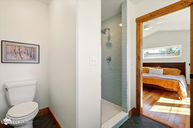 7350 E Narnia Cir, Palmer, AK 99645 - full bath featuring a shower stall, connected bathroom, toilet, tile patterned flooring, and lofted ceiling