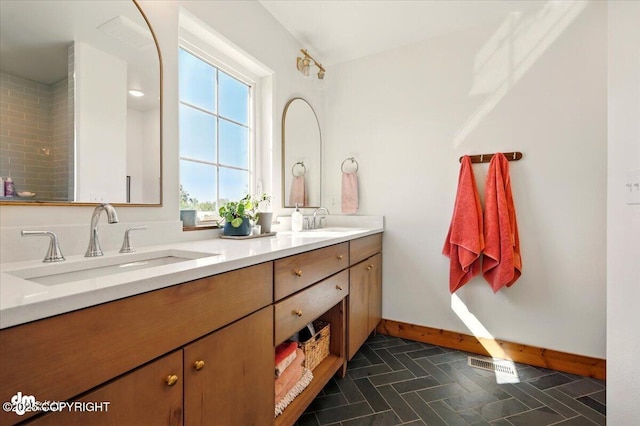 7350 E Narnia Cir, Palmer, AK 99645 - bathroom with double vanity and baseboards