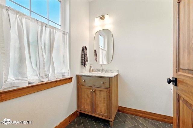 7350 E Narnia Cir, Palmer, AK 99645 - bathroom featuring baseboards and vanity