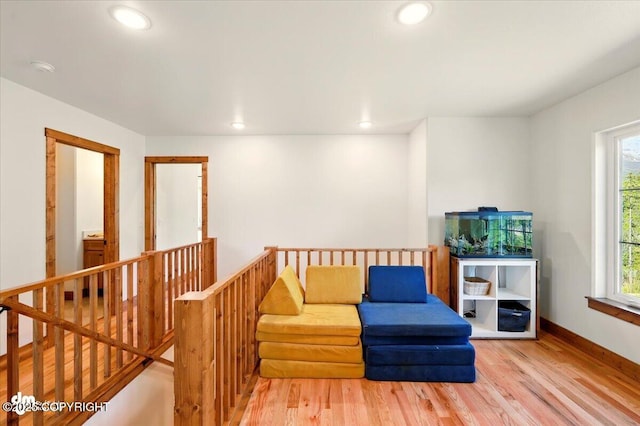 7350 E Narnia Cir, Palmer, AK 99645 - living area with an upstairs landing, wood finished floors, recessed lighting, and baseboards
