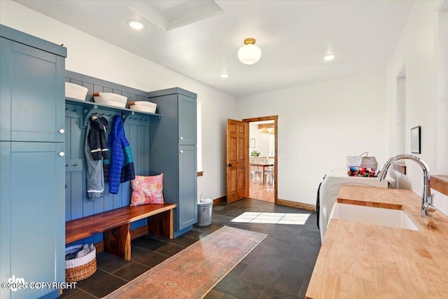 7350 E Narnia Cir, Palmer, AK 99645 - mudroom with a sink, baseboards, recessed lighting, and independent washer and dryer